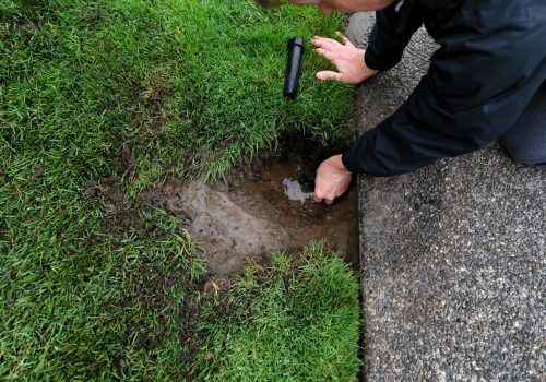 A technician performing Irrigation Repair & Maintenance for a client in Peoria IL