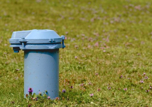 The top of a pump as part of a well installed by TCI Water Well & Pump Service