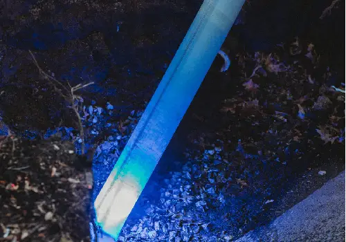 A UV light shining on a pipe during Sewer Line Repair in Peoria IL