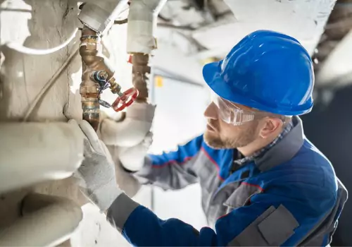 A Plumbing Company in Bloomington IL performing work on a commercial facility's plumbing system