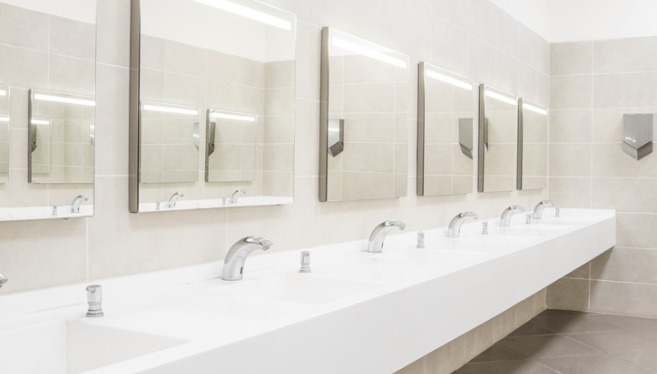A commercial bathroom’s sinks. TCI Plumbing offers commercial plumbing services.