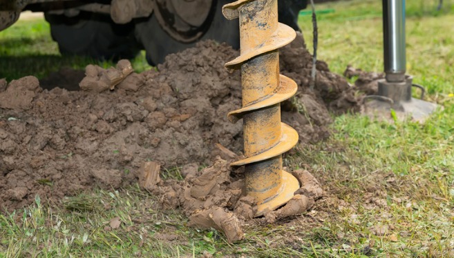 A large drilling machine from TCI Companies drills a well as part of its Water Well & Pump Services work.
